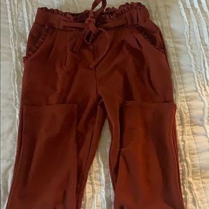 Red dressy trousers.